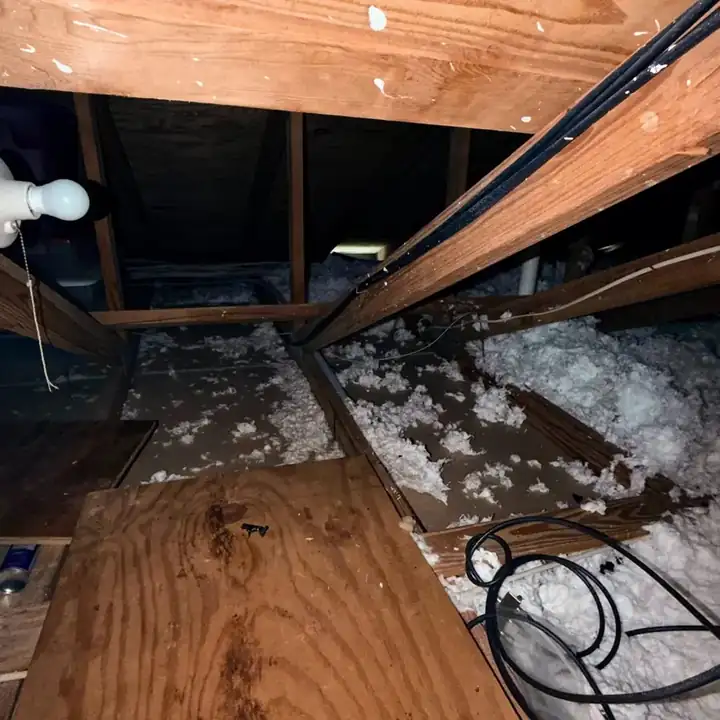 Air duct repair work performed in an attic